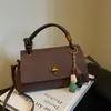Nova bolsa de mão niche estilo coreano 2025 nova moda bolsa transversal cor sólida texturizada bolsa elegante de alto valor para mulheres