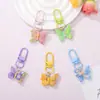 Llavero de mariposa de colores pastel, exquisito colgante para mochila de estudiante, llavero de coche, accesorio de nicho de alta apariencia al por mayor