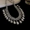 Traje de collar y pendientes de diamante ovalado europeo y americano exagerado luz de lujo alta gama cadena de clavícula nicho moda joyería al por mayor