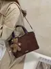 Bolsa de cubo de moda retro de alta gama 2026 transfronteriza, bolso de mano versátil casual, bolso de hombro, bolso cruzado
