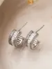 Corea del Sur lujo ligero elegante de moda semicírculo micro incrustación de circón Super flash aretes versátiles aretes de alta calidad que no se decoloran