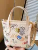 Bolso Lindo de Dibujos Animados Graffiti para Mujer 2025 Nuevo Bolso Cubo de Aspecto Elegante Bolso Cruzado Casual de Hombro de Moda