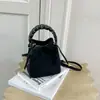 Bolso tipo cubo casual de color liso con diseño de nicho, bolso de hombro/cruzado moderno y elegante, bolso de mano moderno y único con sensación relajada