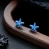 Brincos Cluster de Diamante Cheio de Novo Estilo Transfronteiriços para Homens, Modernos e Versáteis, Brincos de Flor de Íris em Forma de Cruz de Alto Padrão para Mulheres