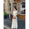 Procesamiento OEM, diseño irregular, camiseta base de punto de manga larga suave y acogedora para mujer, top interior adelgazante para primavera y otoño
