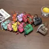 Nuevo y moderno colgante de mini bolso de platino, bolso de lipstick de alta gama, decoración de bolso para auriculares, accesorio de llavero para coche, venta al por mayor