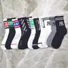 Meias soquete femininas Zhuji, meias de cano médio estilo japonês para primavera e outono, meias folgadas de cor sólida respiráveis que absorvem o suor, meias masculinas de fábrica no atacado