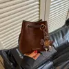 Bolso cubo coreano de mujer nuevo para otoño 2026 transfronterizo, moderno, versátil, elegante, simple, retro, de mano, de hombro y cruzado