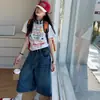 Conjunto de Verano para Niñas 2026 Nuevo Conjunto de Dos Piezas con Camiseta Estampada de Letras y Pantalones Cortos para Niños Mayores Jeans Vintage