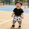 Ropa para niños Versión coreana de pantalones cortos para niños Tide fan ropa de verano pantalones de pp de cactus pantalones de rayas de bebé una generación de cabello