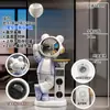 Luminária Projetora de Céu Estrelado, Figura de Astronauta, Caixa de Som Bluetooth, Cofre Grande de Chão ao Lado do Rack da TV na Sala de Estar