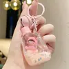 Nuevo Llavero de Botella de Deriva de Dibujos Animados con Arena Movediza Colgante de Muñeca Femenina Rellenado de Aceite Llavero Personalizado para Coche Mayoreo