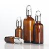 Venta al por mayor de fábrica botella de aceite marrón botella con gotero de vidrio marrón 10ml30ml50ml botella con gotero de cabeza de goma