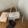 Bolso de mano transfronterizo con lazo para mujer, nuevo modelo de primavera 2026, bolso de hombro y cruzado, bolso cuadrado pequeño lindo de moda nicho