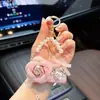 Influenciador mesmo estilo pequena bolsa Chanel camélia modelo chaveiro de carro moderna pequena bolsa floral não abre ornamento para pendurar