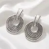 Pendientes ins plisados geométricos lisos de estilo europeo y americano, pendientes de lujo ligero de alta gama, accesorios transfronterizos exagerados y únicos