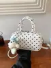 Bolso de lunares de nicho transfronterizo para mujer, nuevo y exquisito minibolso cruzado versátil 2026, bolso cilíndrico de un solo hombro a la moda