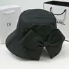 Sombrero estilo coreano de moda para mujer, sombrero de pescador versátil, primavera y otoño, abertura trasera con lazo, moda casual, protección solar, sombrero de sol
