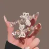 Presilha de Cabelo Laço Pérola Cristal Coração Amor Coreano Luxo Leve Doce Menina High-End Para Franja Presilha Bico de Pato
