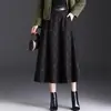 Falda de lana a cuadros de longitud media para mujer para el invierno 2026, nuevo diseño de cintura alta, que cubre las caderas, adelgazante, retro y con una caída fluida