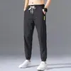 Calça de seda gelada masculina verão fina secagem rápida tendência solta lazer esportiva ponta nove pontos Ar condicionado calça pronta entrega atacado