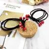 Corea del Sur nuevo tocado accesorios para el cabello corbata liga para el pelo banda para el pelo con diamante pequeñas cuentas de color rojo cereza cubierta de cuero tienda de 2 yuanes