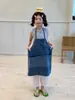 Macacão Jeans Feminino Hua Yu Xun 2026 Verão Novo Estilo Coreano Design de Nicho Estilo Alcinha com Avental Tendência