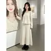 Conjunto completo de outfit estilo coreano para mujer, nueva colección otoño e invierno, conjunto de dos piezas de suéter de punto pesado con lazo y falda, moderno