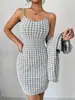 Conjunto de terno xadrez estilo europeu e americano com jaqueta curta e saia de suspensório, conjunto feminino elegante e slim de duas peças