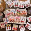 Pendientes de Clip de Resina Coloridos Lindos con Forma de Personaje de Dibujos Animados para Niñas, Accesorios de Pendientes de Lazo Corazón Explosivo