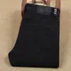 Jeans reto slim masculino 23 Outono novo casual preto stretch algodão grosso Calças compridas masculinas de negócios