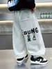Pantalones de Forro Polar para Niños Otoño e Invierno 2025 Nuevos Elegantes Streetwear Pantalones de Chándal de Forro Polar para Niños Tendencia