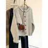 Cárdigan de punto con cuello redondo color albaricoque para mujer Otoño Invierno 2026 Nuevo Diseño Sensación Nicho Ropa exterior Perezoso Suave Esponjoso Abrigo Suéter