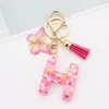 Venta Caliente Transfronteriza a-z Resina Letra Inglesa Lentejuelas Llavero Mariposa Rosa Borla Colgante Colgador de Mochila Mujeres
