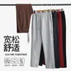 Pantalones de algodón chino de peso pesado de 320 g con dobladillo curvo, pantalones deportivos unisex de marca moderna, pantalones negros con patchwork, pantalones rectos holgados largos