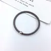 Versión coreana de tienda de 2 yuanes cuentas doradas pequeñas liga de goma anillo para el pelo simple sin costuras pelo fino cuerda para el pelo accesorios para el cabello al por mayor