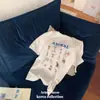 Camiseta Retro Estilo Americano Estampada Manga Curta Design Feminino Senso de Design Nicho Estilo Ocidental Simples Fina de Algodão Top de Ombro