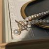 Colar de pérolas de água doce com fivela OT incrustada de diamantes e luz forte, design de moda coreana, vento frio, perto da corrente de clavícula de pérolas de água doce redonda