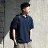 Camisa Polo Masculina de Manga Curta Cor Sólida Japonesa Verão Nova Simples Tendência Marca Design Solto Camiseta Casual Top