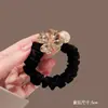 Explosivo trevo de quatro folhas flash diamante pérola corda de cabeça moda menina rabo de cavalo temperamento corda de cabelo preto durável anel de cabelo tripa pequena