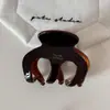Pinza para coleta alta de acetato con un toque de alta gama, pinza de tiburón versátil con etiqueta dorada, elegante accesorio para el cabello en la parte posterior de la cabeza para mujer