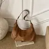 Nova bolsa transfronteiriça em formato de bolinho, versátil para mulheres, adequada para o trabalho, bolsa transversal, bolsa em formato de meia-lua, novo estilo 2026, bolsa de ombro em camurça, bolsa de axila
