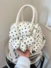 Bolso de mano de moda transfronterizo con lunares frescos, bolso tipo concha versátil de diseño nicho y moderno, bolso cruzado casual dulce con estampado floral
