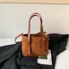 Moda Caricatura Simple 2026 Mujer Otoño Nuevo Versátil para el Trabajo Bolso de Hombro Único Bolso Cruzado de Moda Nicho de Alta Gama