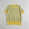 Moda Femenina Nueva Estilo Europeo y Americano Primavera/Verano 2026 Suéter de Punto Simple a Rayas Manga Corta con Bloques de Color Cuello Redondo Ajustado Pulóver Versátil