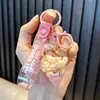 Chaveiro de panda cheio de óleo, garrafinha com areia movediça de maçã, pingente de bolsa, chaveiro de carro, prêmio de máquina de pegar, pequeno presente