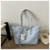 Bolsa de mano informal de gran capacidad estilo coreano, nuevo modelo verano 2026, bolso de hombro para llevar bajo el brazo con diseño texturizado de estrella y lunares