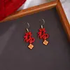 Pendientes Ancola Corazón Rojo con Lazo para Otoño e Invierno, Realzan el Cutis y Hacen que el Rostro Parezca Más Pequeño, Lujo Ligero con un Toque de Alta Gama, Pendientes de Estilo Año Nuevo