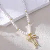 Colar Retrô Europeu e Americano Transfronteiriço com Laço de Pérola Banhado a Ouro 14K com Design Estiloso e Pingente Cravejado de Diamantes