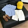 Conjunto para Niños 2026 Verano Estilo Academia Camisa a Cuadros Nueva Marca Trendy Infantil Cárdigan Pantalones Cortos Versátiles Conjunto de Dos Piezas